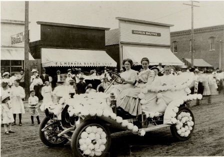 Wilber Republican 50, parade with 2 women, 1 boy, 1 girl riding in Model T car